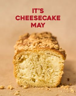 Breads Bakery cheesecake babka with crumb topping, showcasing the creamy filling in a close-up slice.