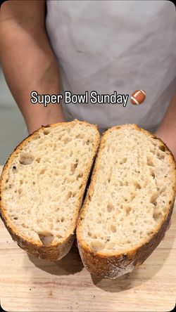 Freshly baked bread sliced to showcase its airy texture, perfect for breakfast or lunch at Breads Bakery.