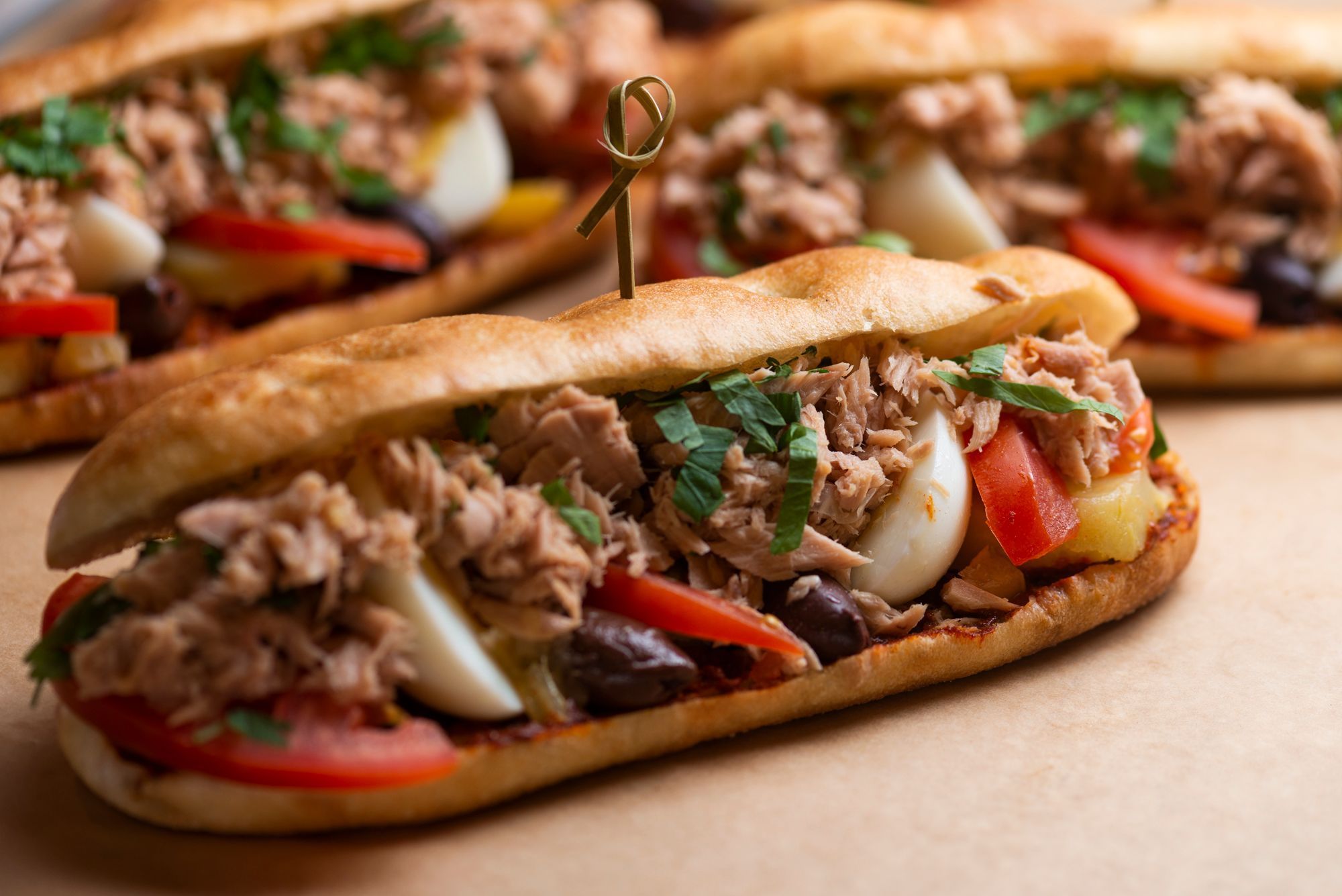 Hearty sandwich filled with tuna, vegetables, and herbs, served at Breads Bakery – Rockefeller Center.