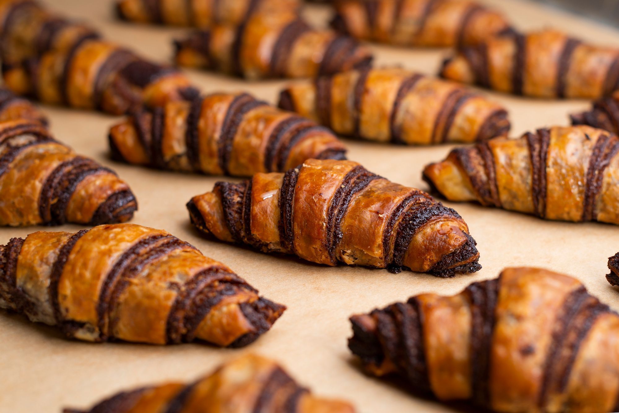 Freshly baked croissants with rich chocolate filling, showcasing the quality of Breads Bakery's pastry offerings.