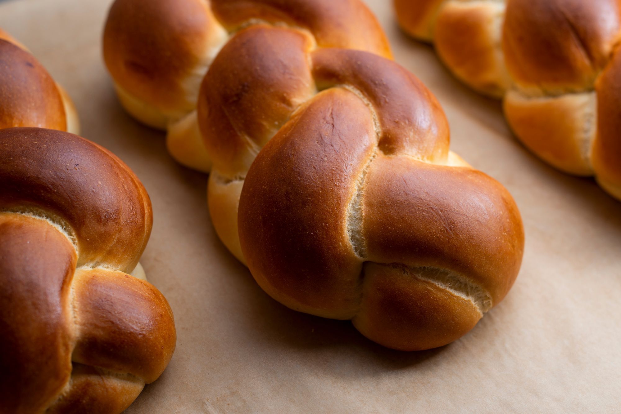Freshly baked braided bread loaves from Breads Bakery, showcasing a golden-brown crust and soft texture.